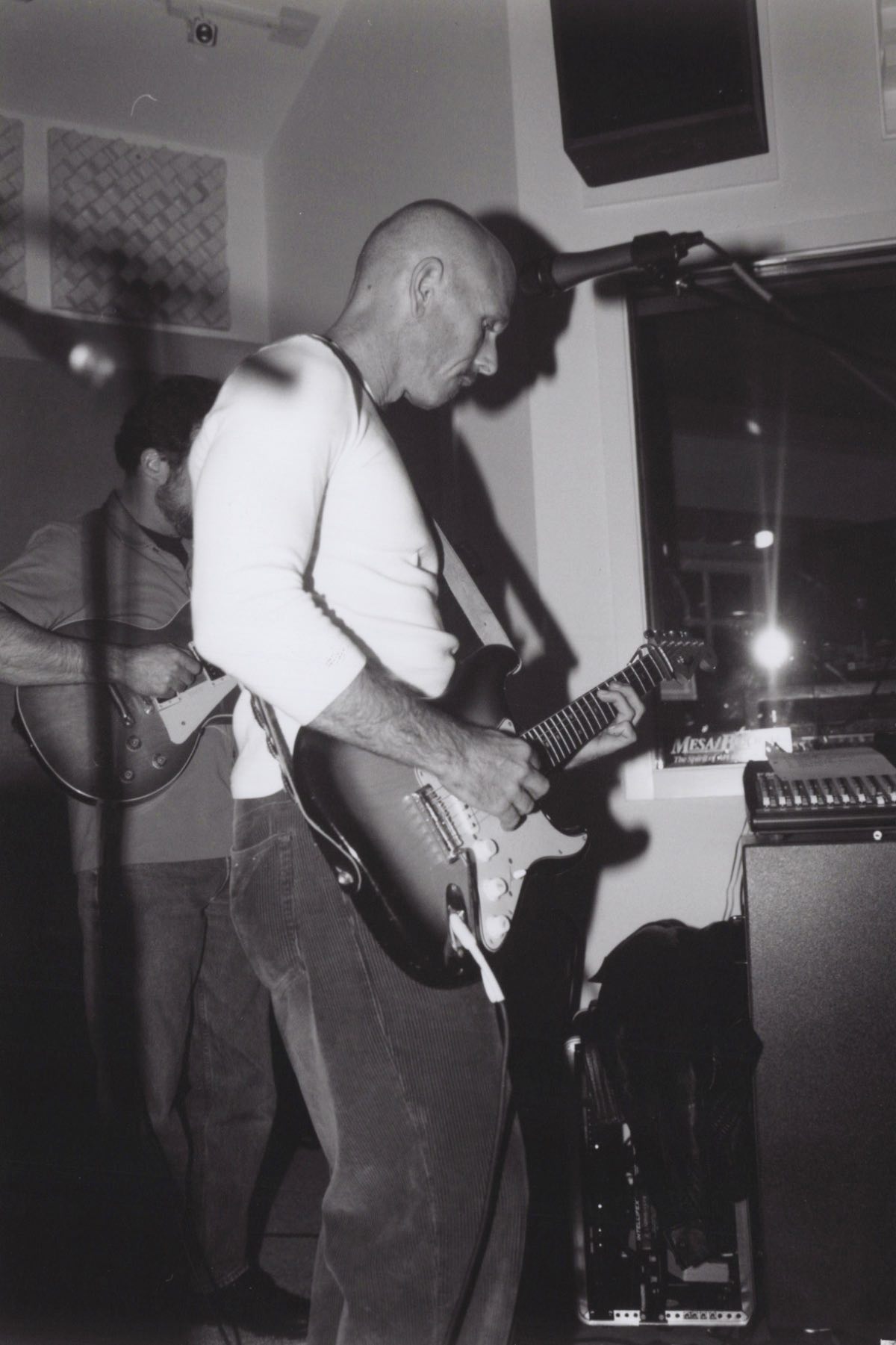 Judd Abrams playing a Stratocaster on a small stage